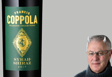 Robert Joseph with horns and Coppola Syrah-Shiraz label